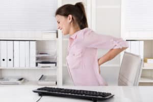 Woman with bad back Shutterstock_226745545